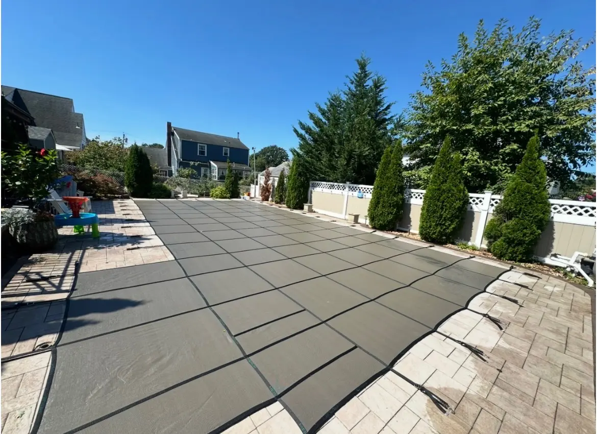 Pool cover secured on a sunny day