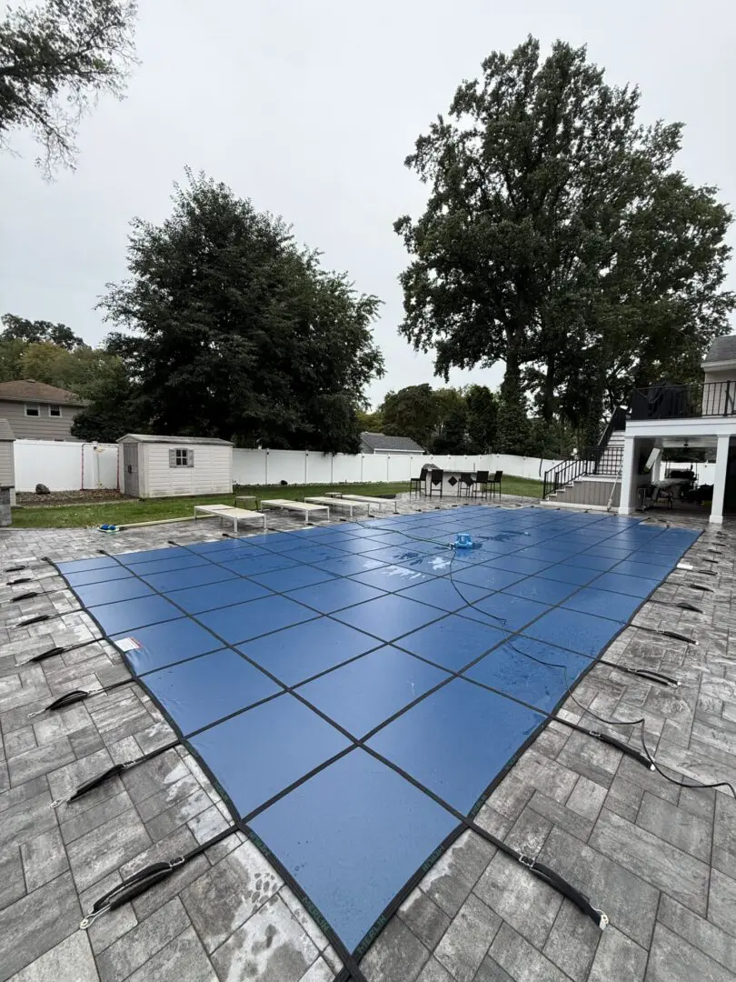Pool cover with cloudy sky overhead